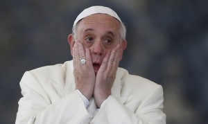 Pope Francis rubs his face after completing the speaking part of his general audience in St. Peter's Square at the Vatican Jan. 15. (CNS photo/Paul Haring) (Jan. 15, 2014) See POPE-AUDIENCE Jan. 15, 2014.